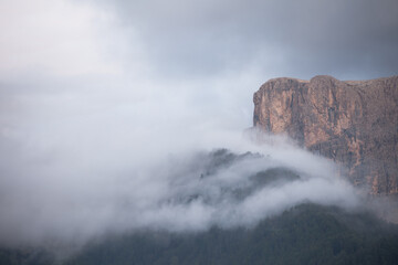 The northern side of Sella group among the clouds from the Val Gardena area