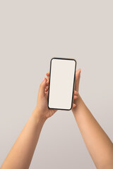 woman hand holding white smart phone with blank space of screen display, smart phone and mockup concept, Isolated on white background