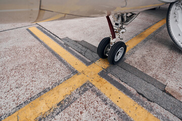 Turboprop aircraft parked on the runway at daytime