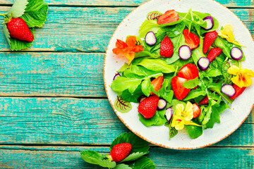 Summer salad with berries and herbs