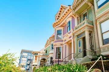 Fototapeta na wymiar Facades of townhouses with famous Victorian architecture, streets in San Francisco