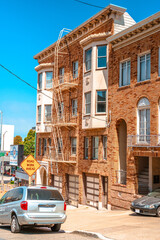 Facades of townhouses with famous Victorian architecture, streets in San Francisco