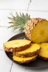 Ripe juicy pineapple cut into rings close-up