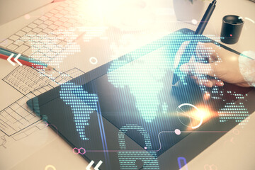 Double exposure of map sketch hologram and woman holding and using a mobile device.