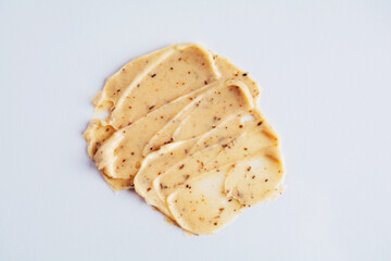 Skin scrub smear on white background. Cosmetic product. Cleansing and exfoliating your skin