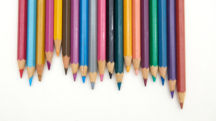 Colorful pencil crayons on a white background