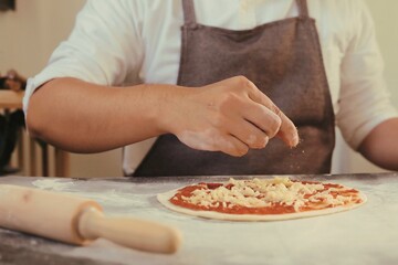 Obraz na płótnie Canvas chef preparing dough