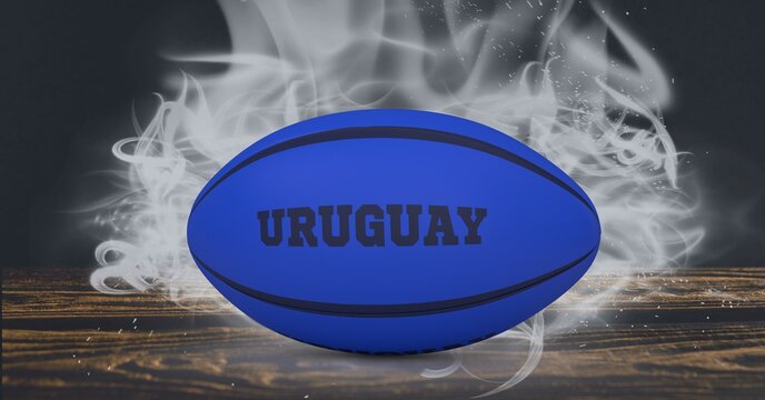 Compostion of rugby ball with text uruguay on black background with white blur