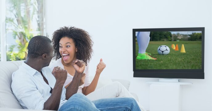 Compostion Of Diverse Couple Watching Football Match On Tv On White Background