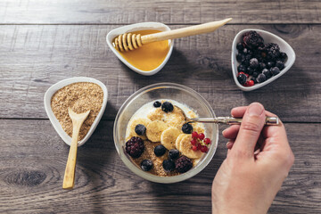 Fresh yogurt with wheat bran and banana and berries