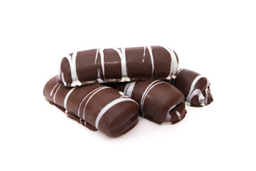 chocolate gingerbread cookies with white icing on a white