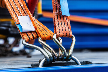 cargo is held by tension safety belts with mechanical locks - obrazy, fototapety, plakaty