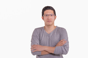 Portrait of confident asia business man standing  with crossed arms in grey shirt