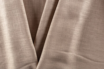 draped surface of linen brown fabric, background