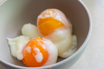 delicious and healthy half boil egg on a bowl
