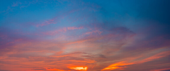 Fototapeta premium Beautiful view of sky with clouds at sunrise. Partly cloudy. Colorful sunset. Natural sky background texture, beautiful color.