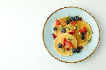 Concept of delicious dessert with pancakes on white background