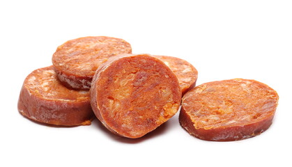 Fermented semi-hard dried spicy sausage slices, pig meat isolated on white background