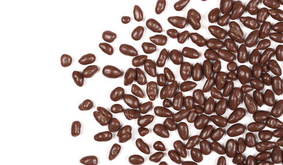 Chocolate covered sunflower seeds isolated on white background, top view