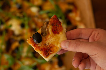 Closeup of a homemade vegan pizza with diary-free cheese alternative.