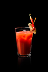 glass of juice on black