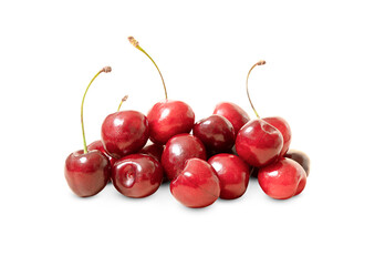 red cherries with twigs lies a bunch isolated on a white background