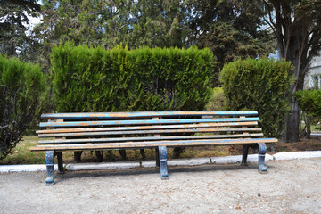 Painted old wooden bench in the park.