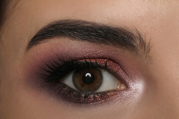 Obraz premium Young woman with evening makeup, closeup. Eye shadow product