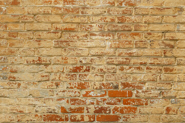 Yellow brick wall with splashes of red