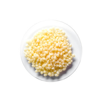 Candelilla Wax SP-75. Chemical ingredient for Cosmetics and Toiletries product on white laboratory table. Top View