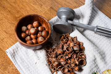 Chopped hazelnuts on a towel. Dried nut husks and kernels.