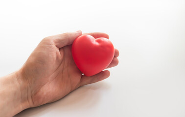 hand holding heart on white background. World Health day concept. Heart health and peace concept. World organ donation day. Concept of healthy heart for healthy life. selective focus