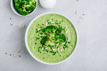 Broccoli cream soup with sunflower and sesame seeds.