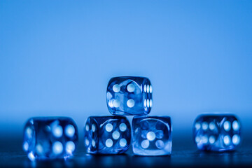 five blue dice on light blue