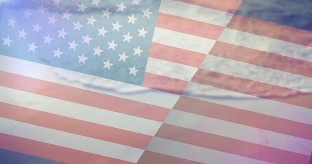 Fototapeta na wymiar Composition of beach and waves over american flag