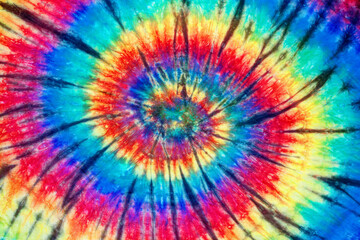 spiral tie dye pattern hand dyed on cotton fabric abstract texture background.