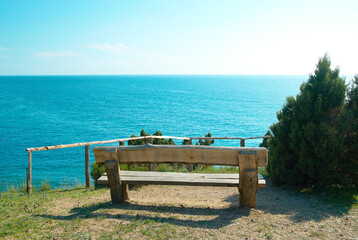 Naklejka na ściany i meble Bench with seaside view