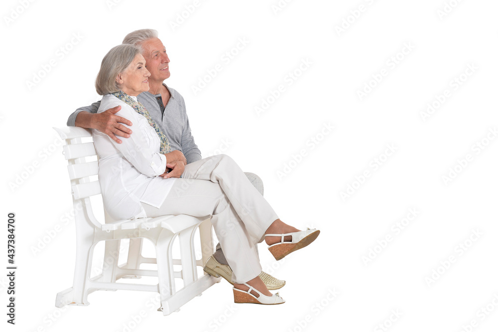 Sticker portrait of  senior couple sitting on bench