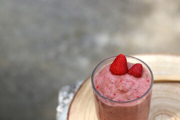 Banana and berry nice cream, served in a garden. Selective focus.