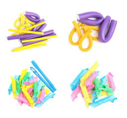 Set with hair curlers on white background, top view