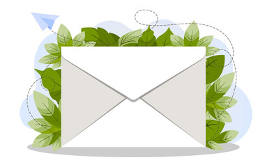 Closed white envelope with bright colorful green summer foliage in the background. The concept of sending a message. Send or receive a letter, mail.