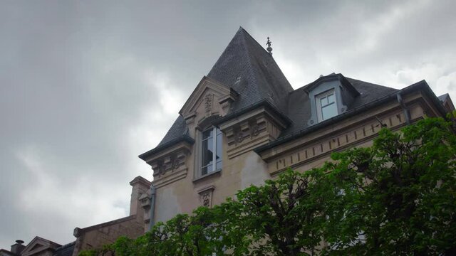 Caen, Normandy, France. Elegant french mansion close up. Cloudy sky in the background.