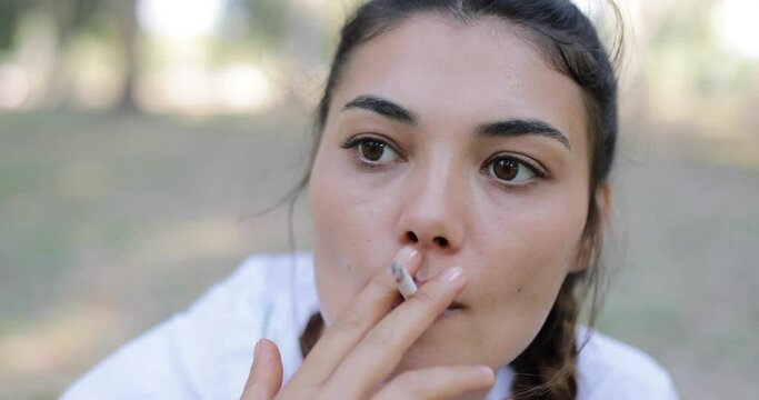 portrait of a woman smoking cigarettes