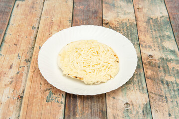 simple arepa with cheese on top