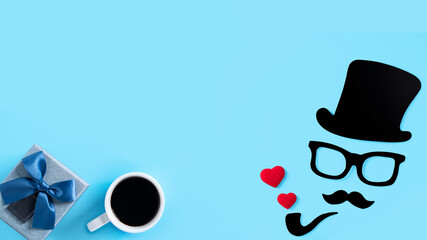 Father's day gift design concept. Top view of paper decoration on blue table background.