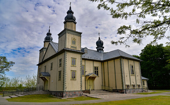 The wooden Catholic church of Saint John the Baptist was built with the belfry in 1871 in Turośl in Podlasie, Poland. The photos also show architectural details.