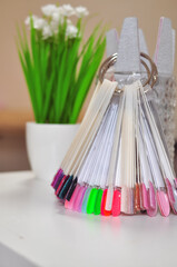 Set of different colors shellac in pallets for manicure and nails design