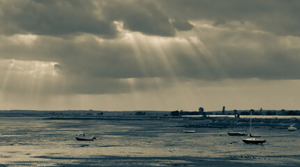Essex seascape with atmospheric sky and sun rays