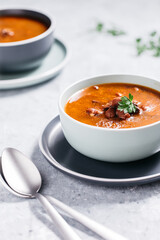 Bean soup with meat, ground paprika and carrot