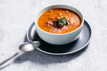 Bean soup with meat, ground paprika and carrot